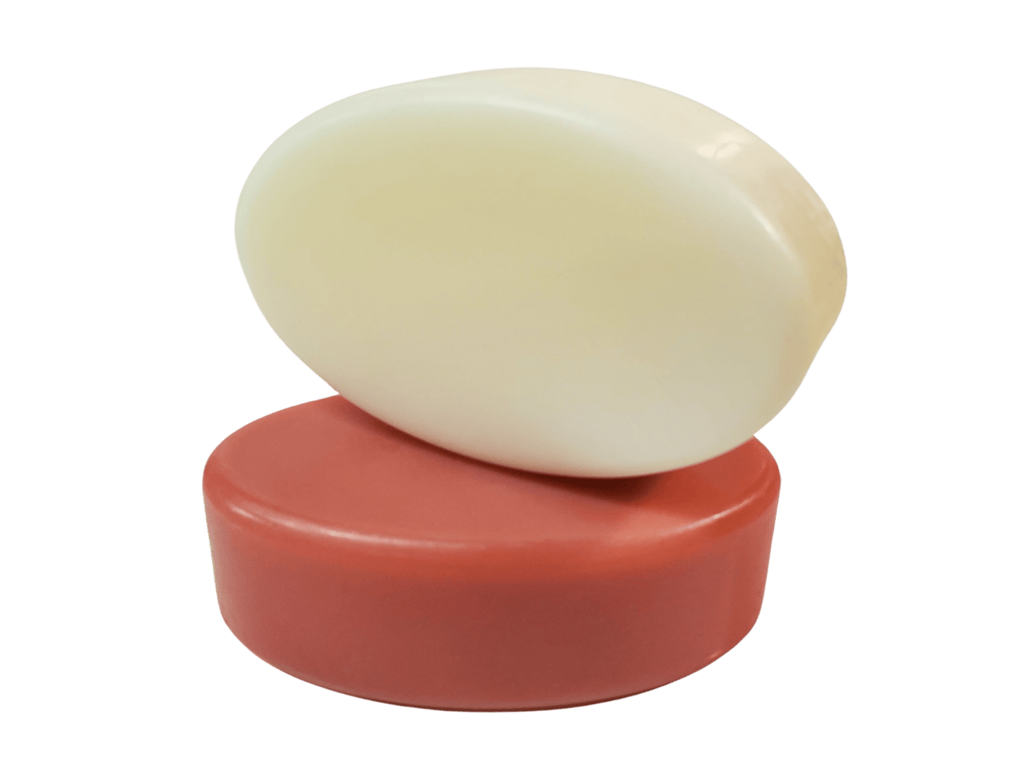 Two oval shaped bars of handmade goat milk soap.