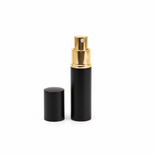Black and gold spray bottle on a white background