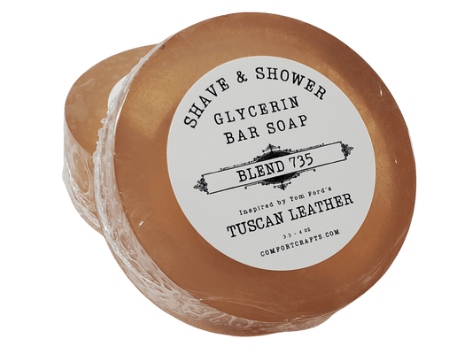 A round puck shaped bar of men's shave and shower soap.